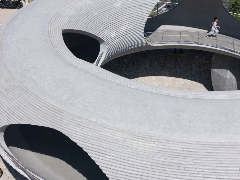 resting loop with views a creekside pavilion among hills by hcch studio