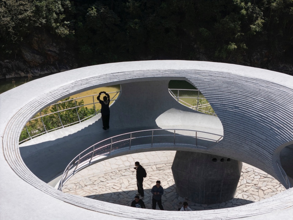 resting loop with views a creekside pavilion among hills by hcch studio