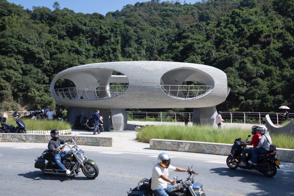 resting loop with views a creekside pavilion among hills by hcch studio