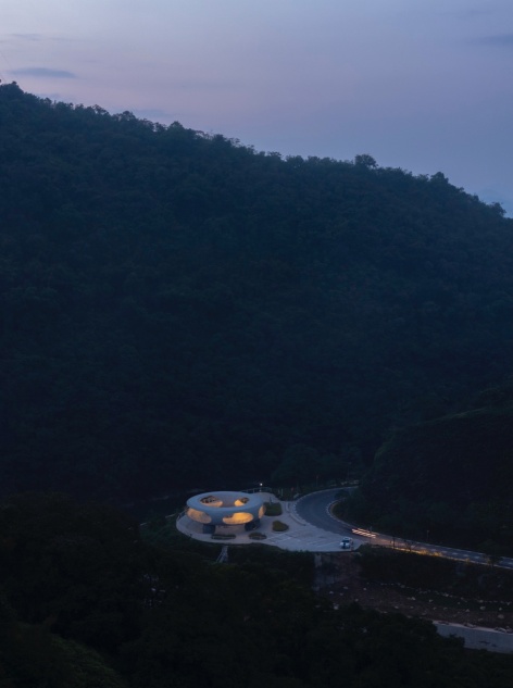 resting loop with views a creekside pavilion among hills by hcch studio