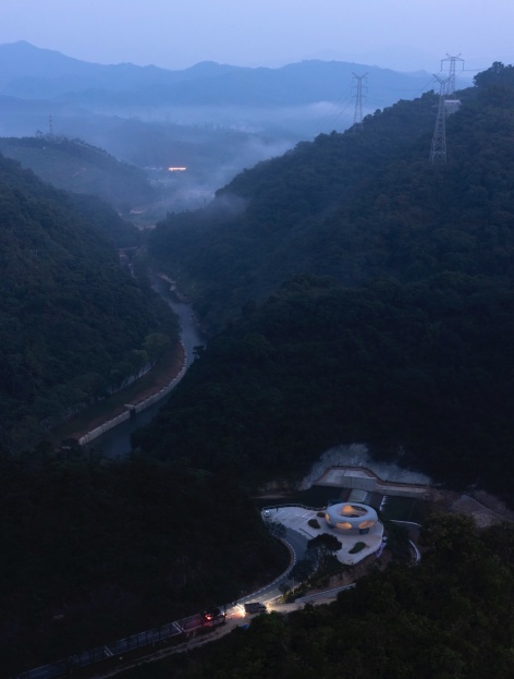 resting loop with views a creekside pavilion among hills by hcch studio