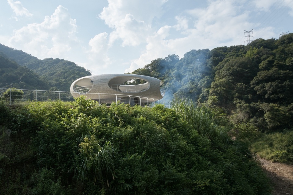 resting loop with views a creekside pavilion among hills by hcch studio