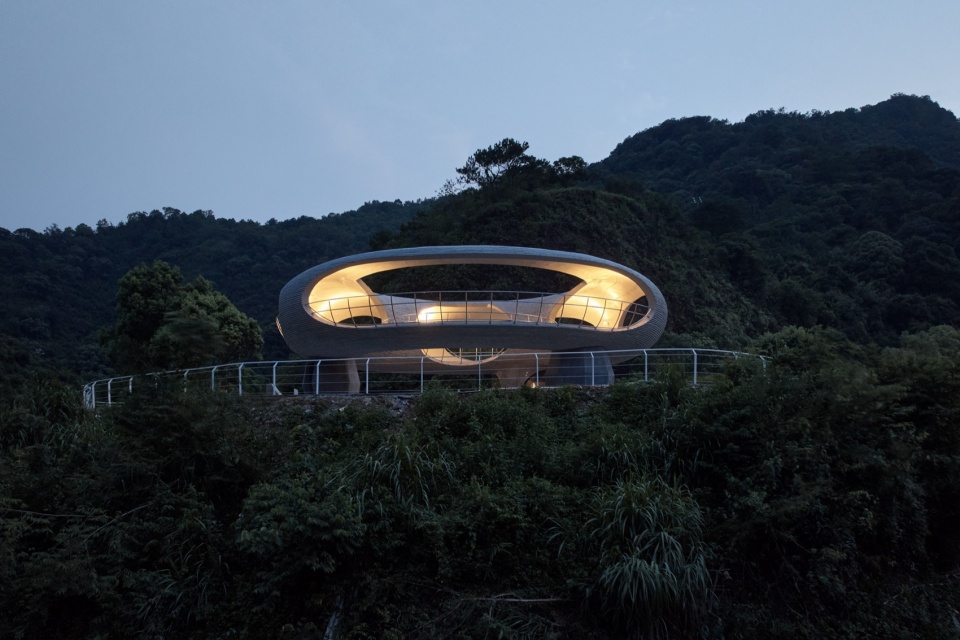 resting loop with views a creekside pavilion among hills by hcch studio