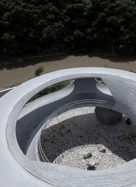 resting loop with views a creekside pavilion among hills by hcch studio