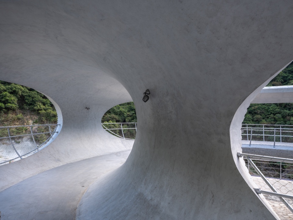 resting loop with views a creekside pavilion among hills by hcch studio