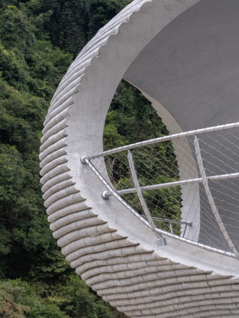 resting loop with views a creekside pavilion among hills by hcch studio