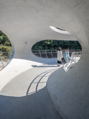resting loop with views a creekside pavilion among hills by hcch studio