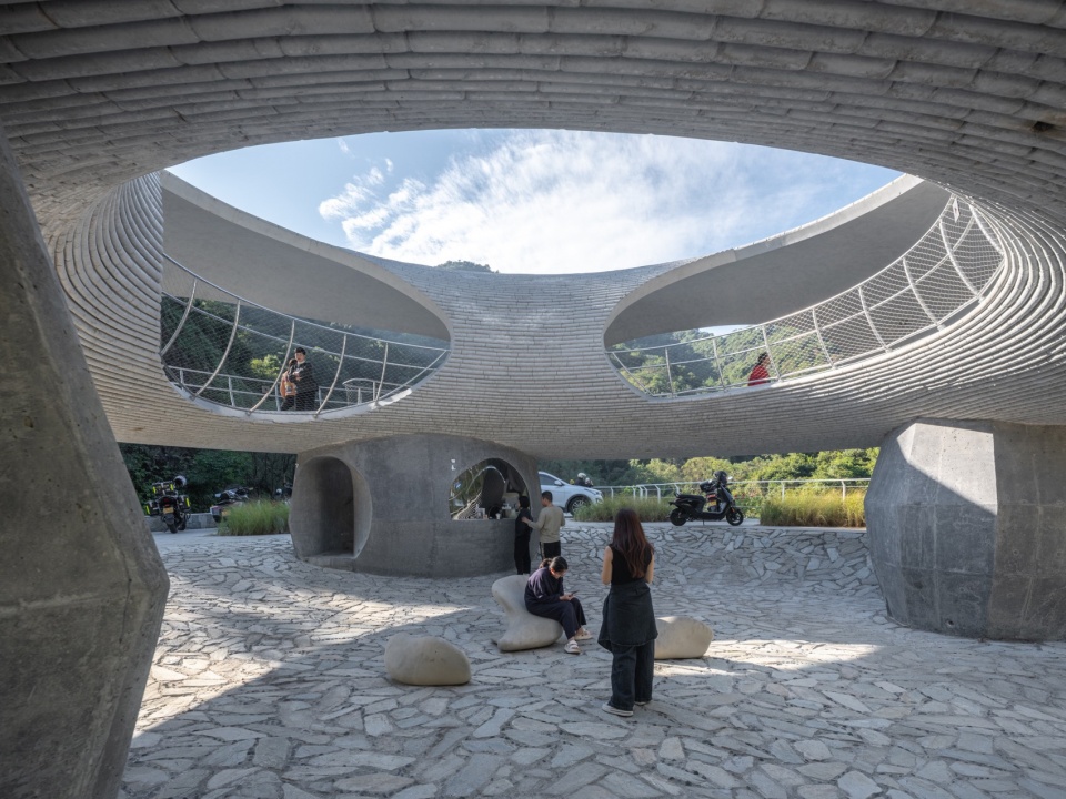 resting loop with views a creekside pavilion among hills by hcch studio