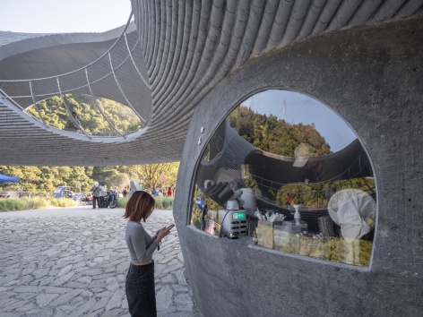 resting loop with views a creekside pavilion among hills by hcch studio