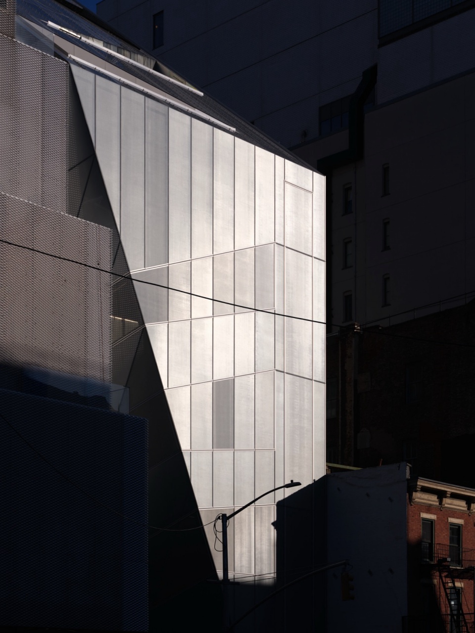 New expansion connected to the existing museum at 235 Bowery by OMA