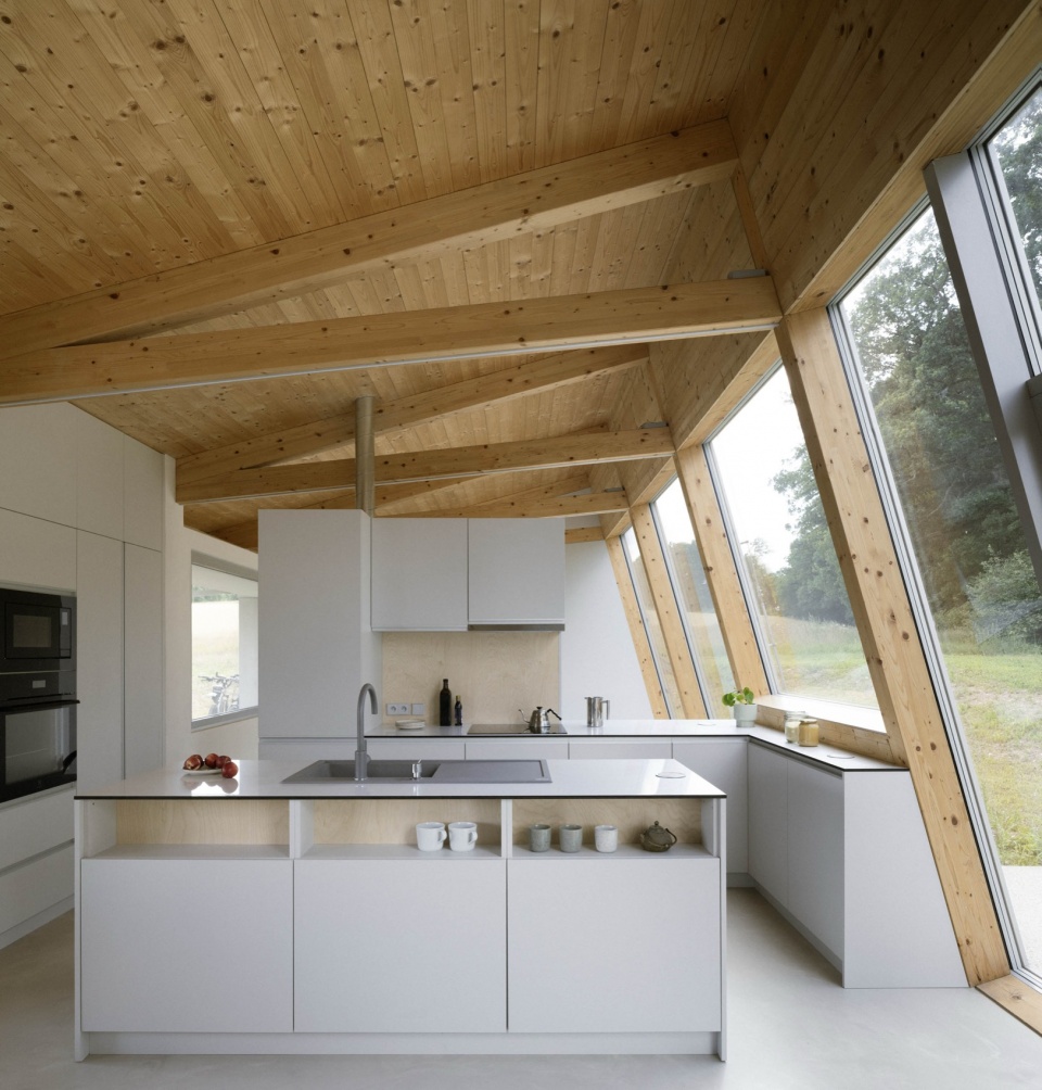 modular house with a sloping facade by papundekl architects