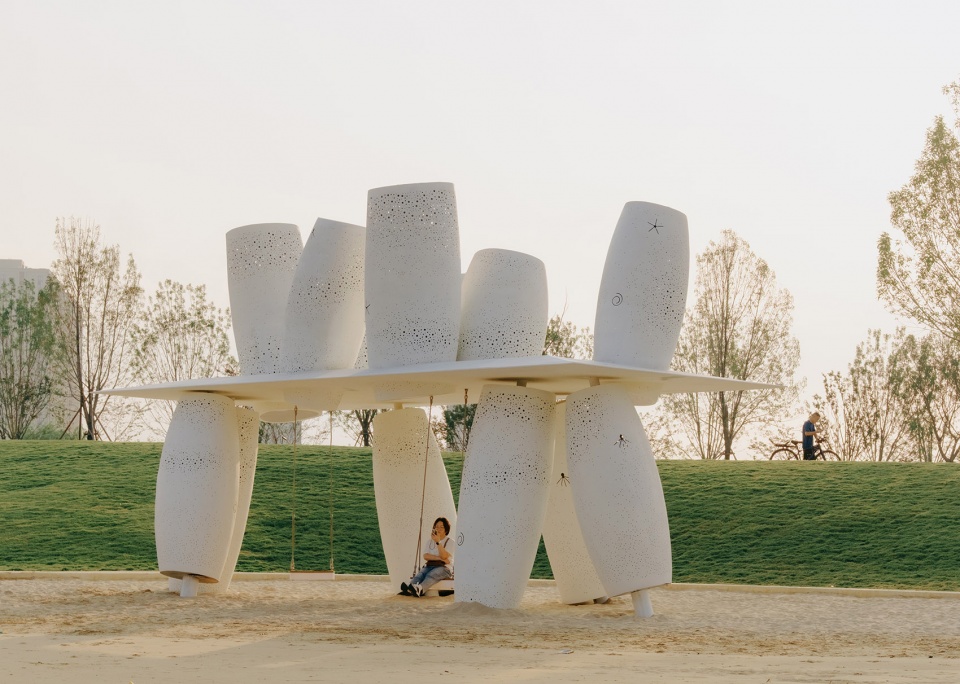 among the corals a seaside swing installation
