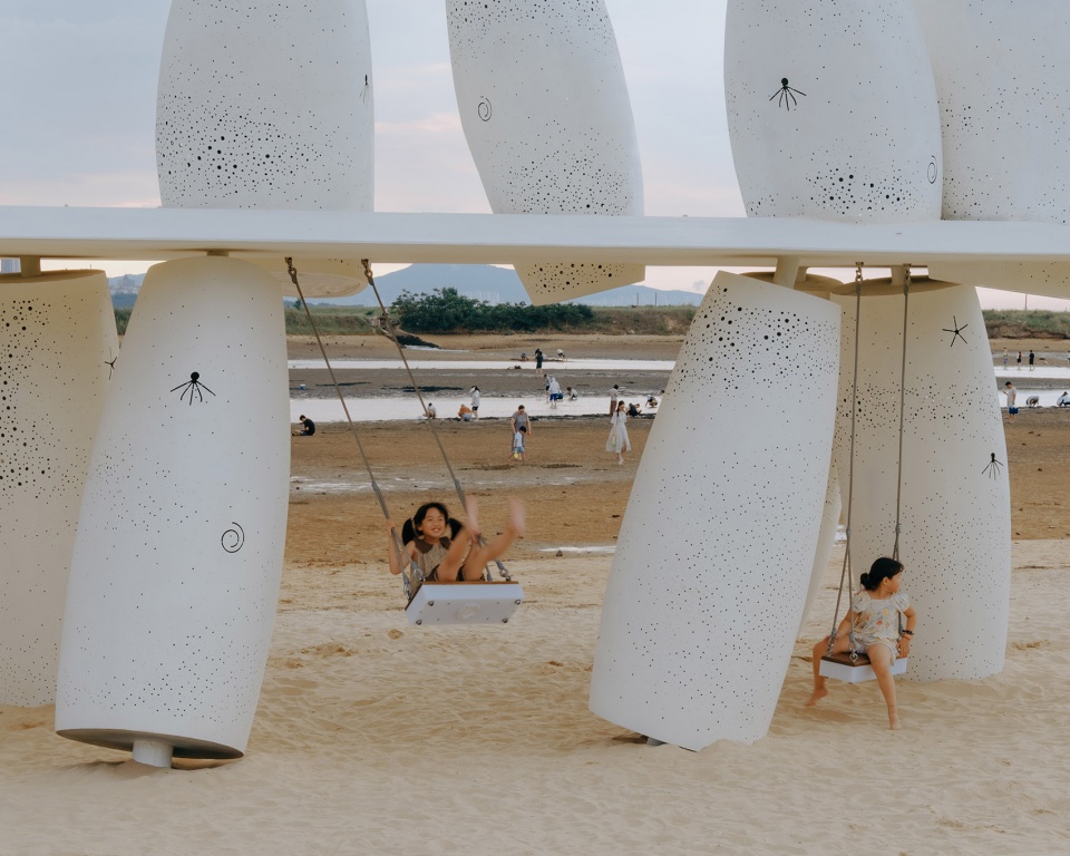 among the corals a seaside swing installation