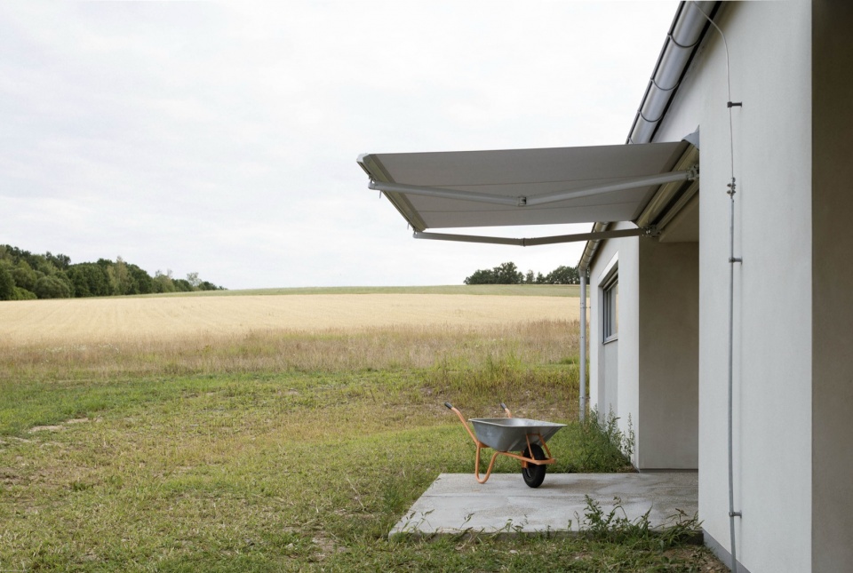 modular house with a sloping facade by papundekl architects