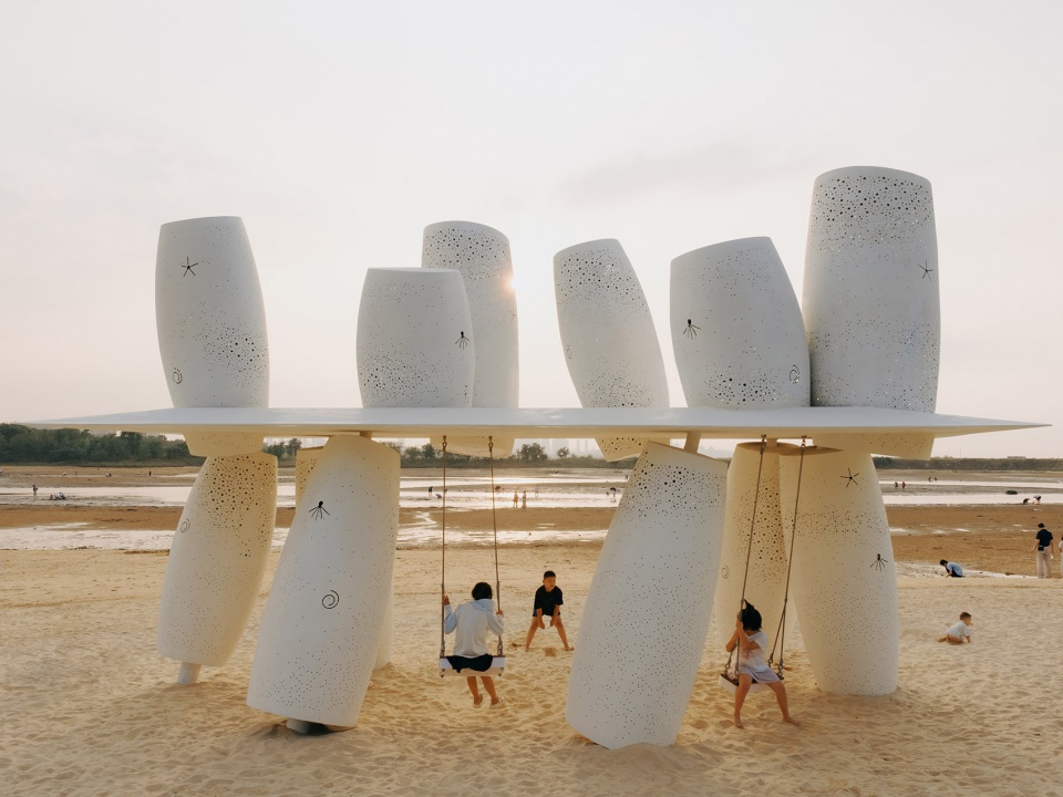among the corals a seaside swing installation