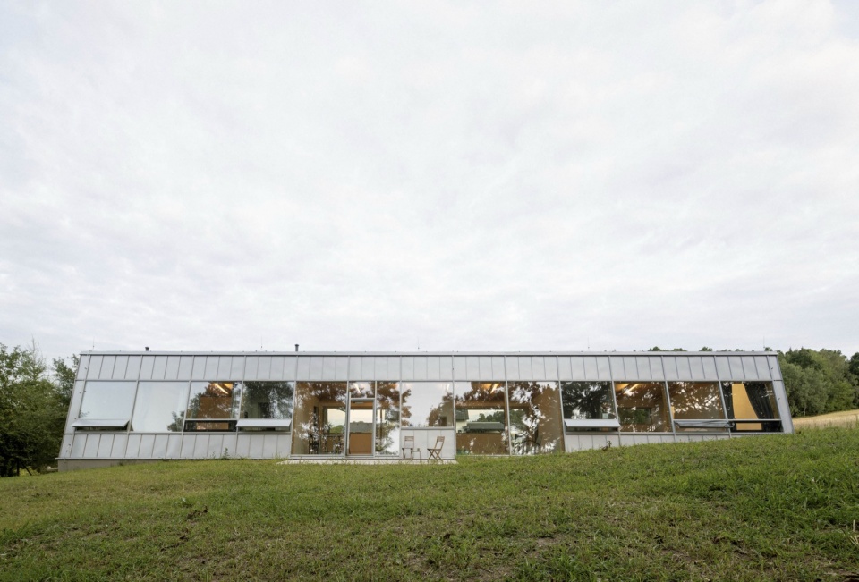 modular house with a sloping facade by papundekl architects