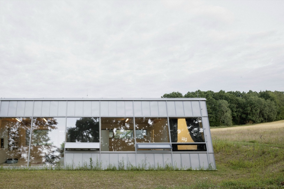 modular house with a sloping facade by papundekl architects