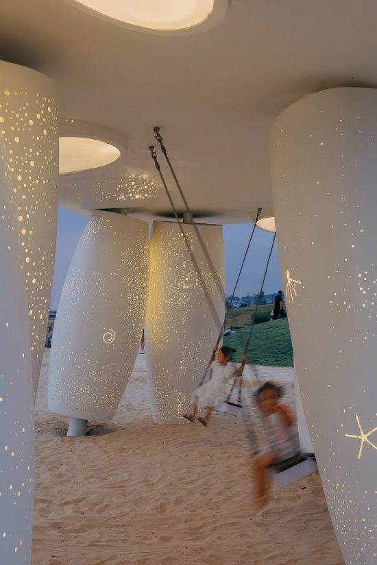 among the corals a seaside swing installation