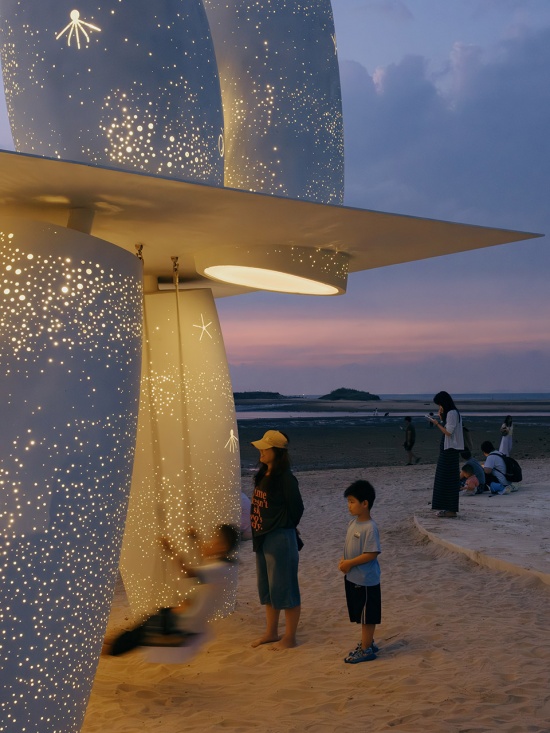 among the corals a seaside swing installation