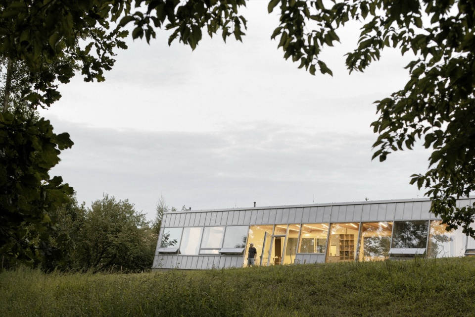 modular house with a sloping facade by papundekl architects