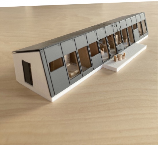 modular house with a sloping facade by papundekl architects